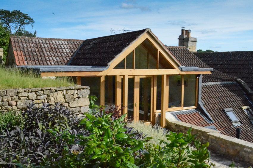 glazed gable extension to cottage letting light in